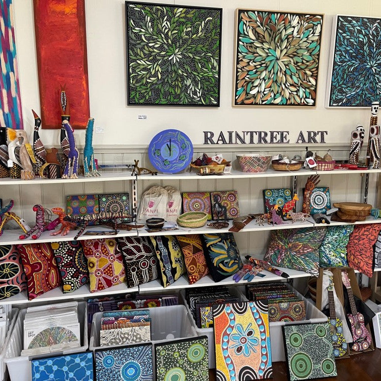 Shelving at Raintree Art, showing a variety of giftware and paintings. Taken at Raintree Art, Aboriginal Art Ballarat.
